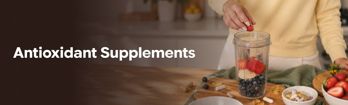 Antioxidant supplements with fresh berries and capsules beside a fruit smoothie.
